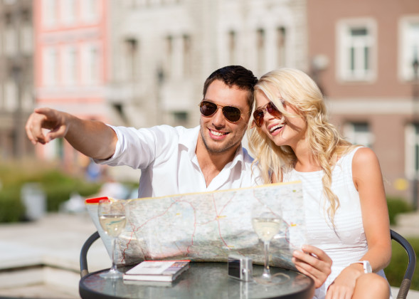 couple with map in cafe
